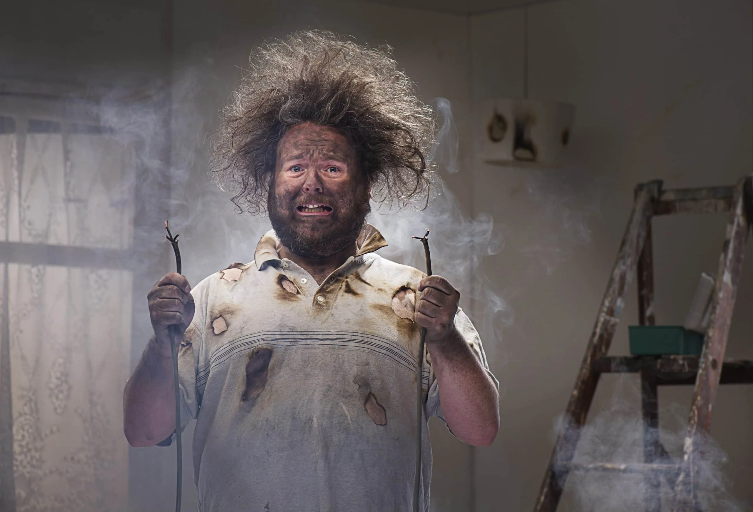 man with crazy hair from electrical explosion