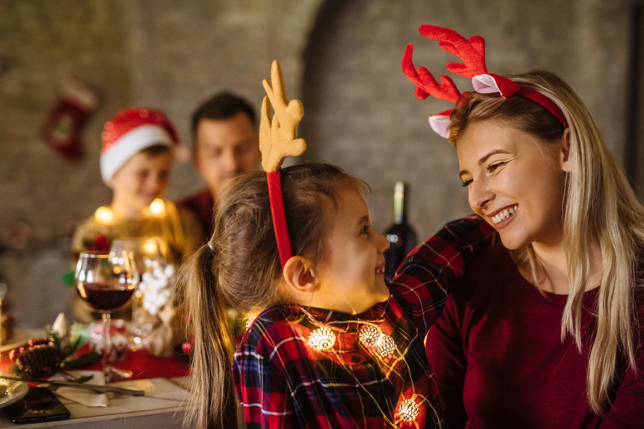 Family enjoying Christmas dinner at home